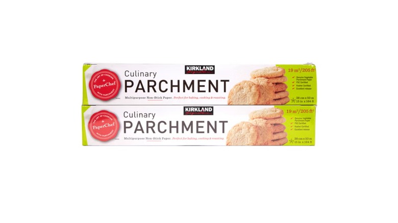 Two rolls of Kirkland Signature culinary parchment paper on white background