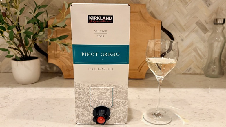 A glass of Costco Kirkland Signature Pinot Grigio boxed wine