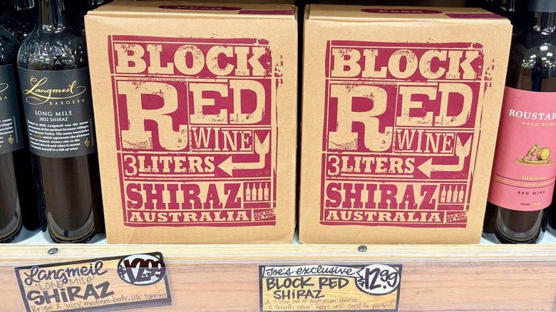 A Trader Joe's store shelf featuring Block Red Shiraz boxed wine