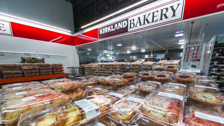 Interior of Costco near bakery section with pastries on display.