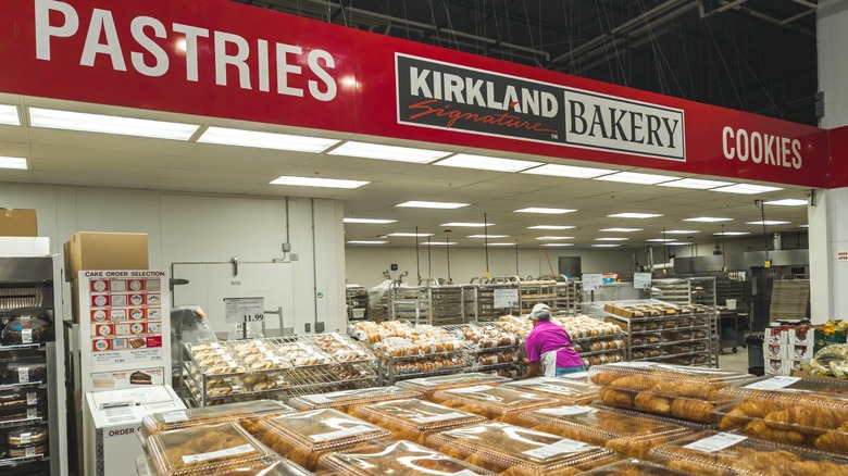 Worker handling products at the Costco bakery section