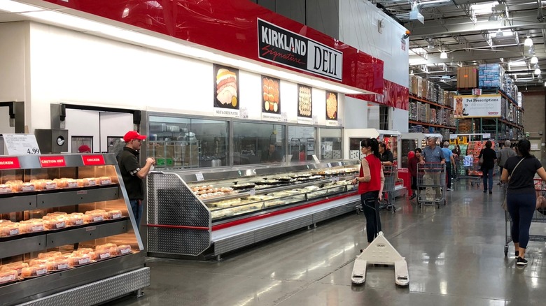 Shoppers and employees in Costco's deli section