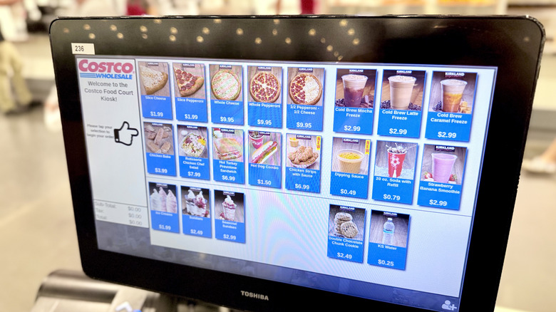 Costco food court touch screen order screen featuring options for pizzas, drinks, ice cream, and hot dogs