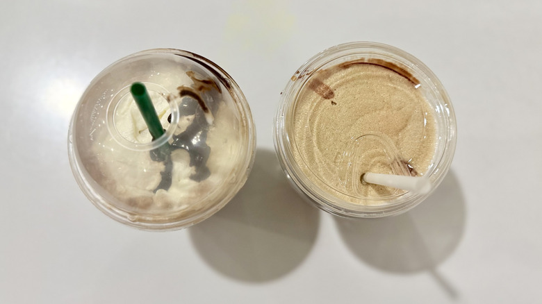 Aerial view looking down into plastic takeout cups of Starbucks and Costco frappes with straws