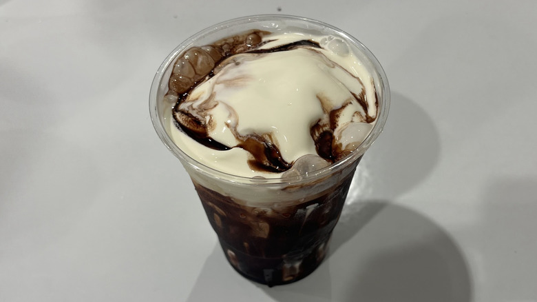 A sundae from the Costco food court with chocolate syrup