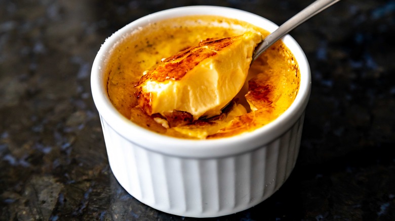 creme brulee and spoon in white ramekin