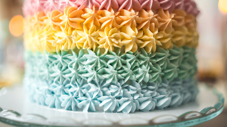 A beautifully decorated cake with layers of pastel frosting