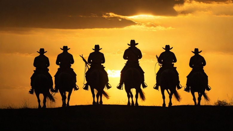 Cowboys on horses silhouette