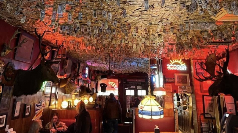 The interior of the Shooting Star Saloon, showcasing the money tacked to its ceiling