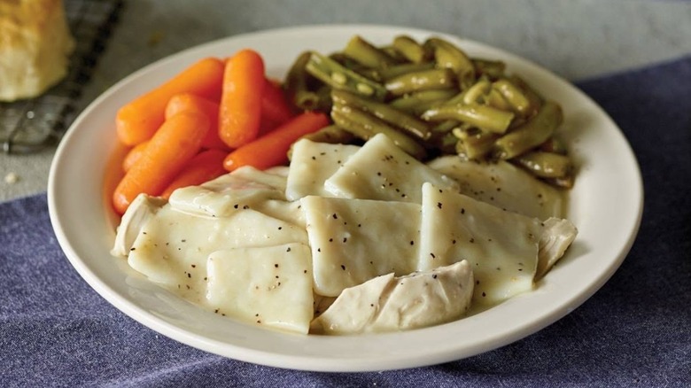 Plate of chicken and dumplings, green beans, and carrots from Cracker Barrel