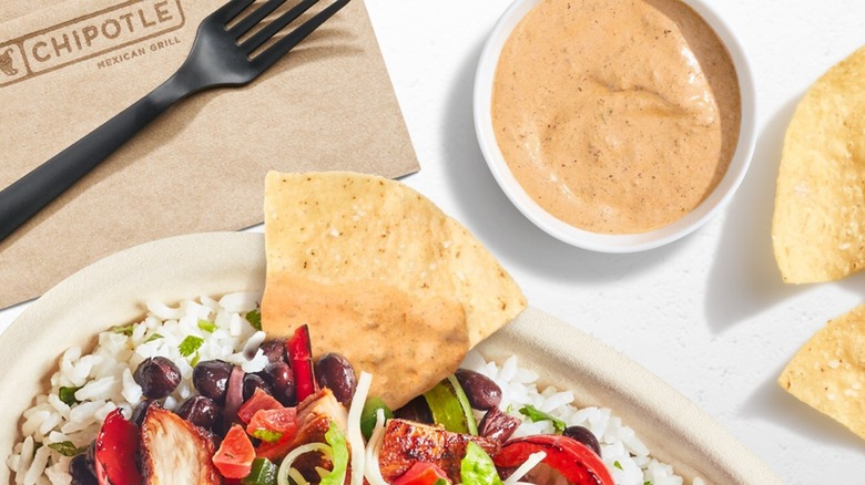Chipotle's adobo ranch dressing with chips and burrito bowl