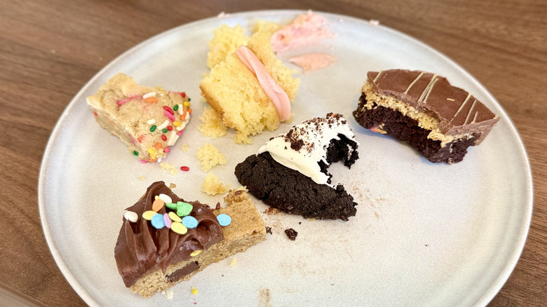 Bites taken out of seveal cookies on a plate