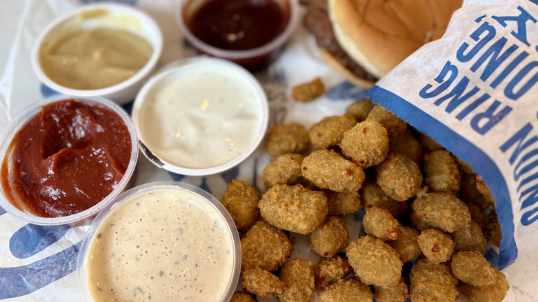 A closeup of Culver's jalapeno cheese curds a variety of sauces