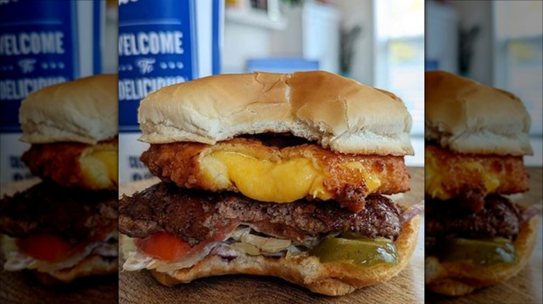 Culver's CurderBurger with a bite taken out of it causing cheese to ooze out