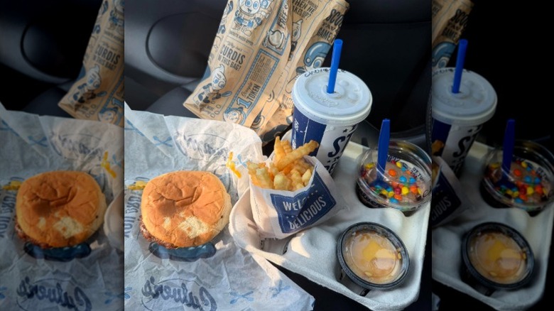One of Culver's ButterBurger kid's meals laid out in someone's car.