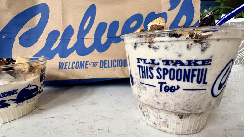 A side view of Culver's Oreo Reese's Cheesecake custard in a cup