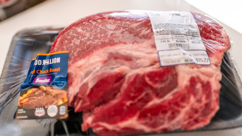 Beef chuck roast on styrofoam wrapped in plastic