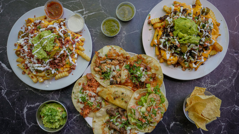 Mexican loaded fries, tacos, and salsas