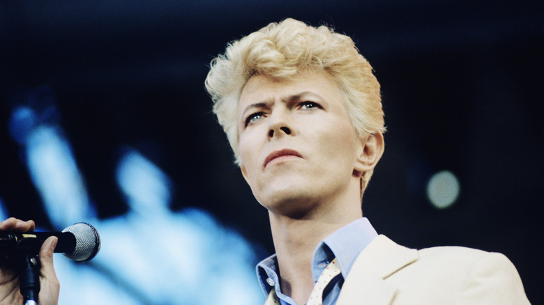 David Bowie on stage with a microphone