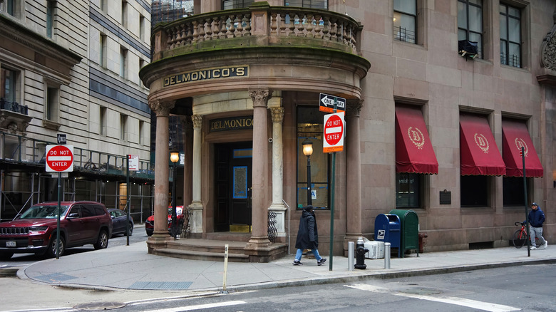 A street view of Delmonico's restaurant entrance in New York City