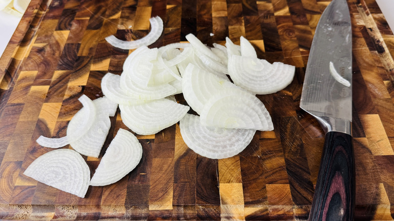 Sliced onions on a cutting board