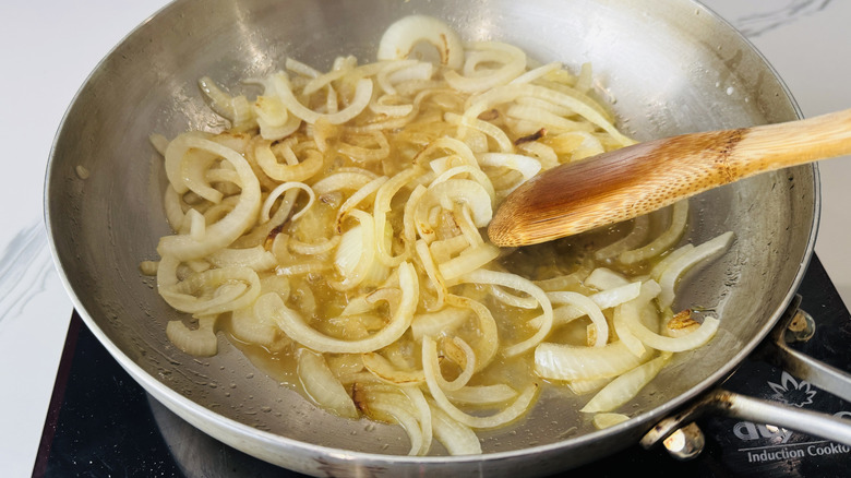Caramelized onions cooking in a saucepan