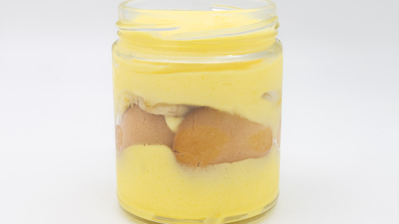 layered banana pudding in a small glass jar