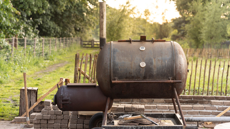 large smoker grill in a backyard