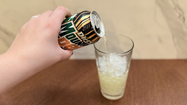 Pouring soda into glass