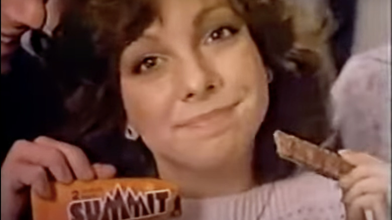 1981 commercial with smiling student holding a Summit bar