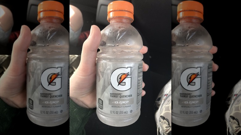 Photo of a hand holding a bottle of Gatorade Ice Punch