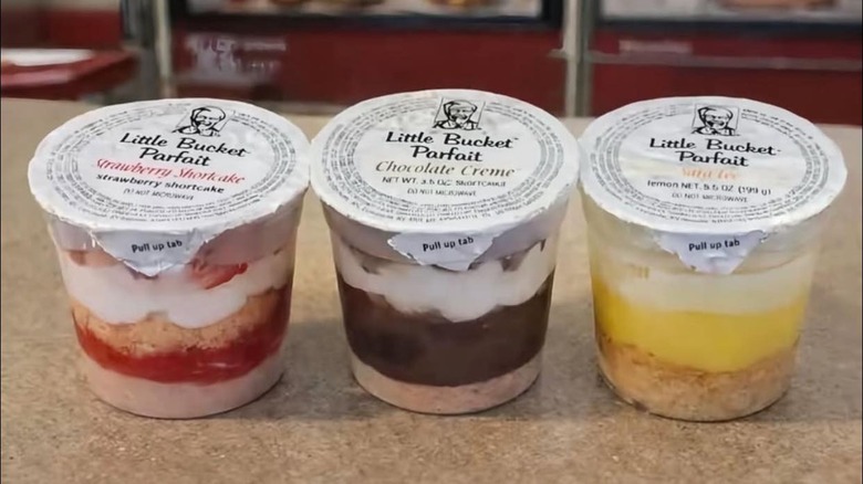 Three KFC Little Bucket Parfait containers on a counter