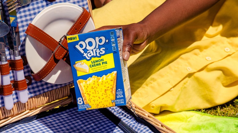 Hand holding box of Lemon Crème Pie Pop-Tarts