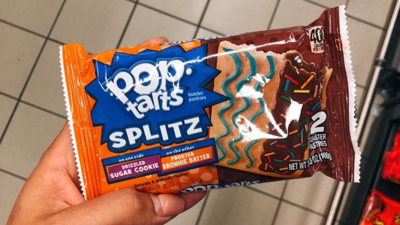 Hand holding packet of Splitz Sugar Cookie & Brownie Batter Pop-Tarts