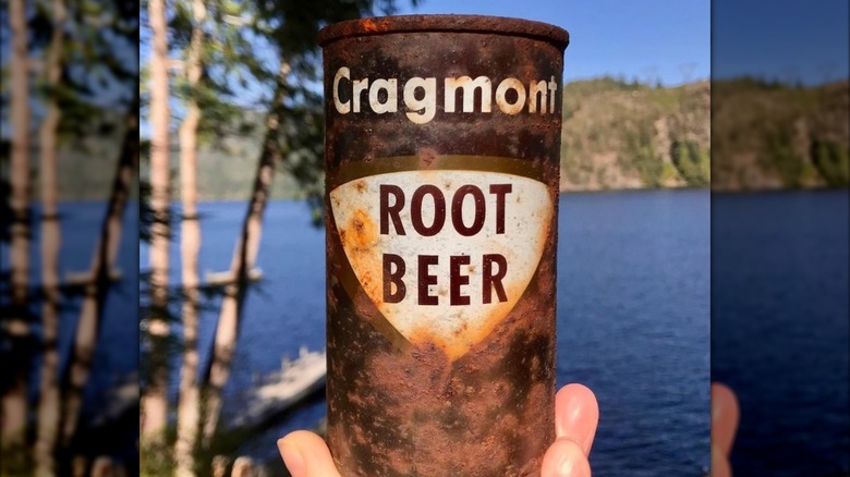 hand holding can of Cragmont root beer