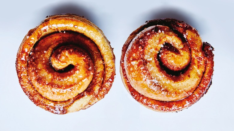 Overhead shot of two morning buns against gray background