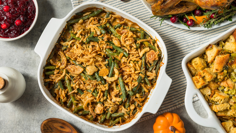 Green bean casserole in white dish on potluck table
