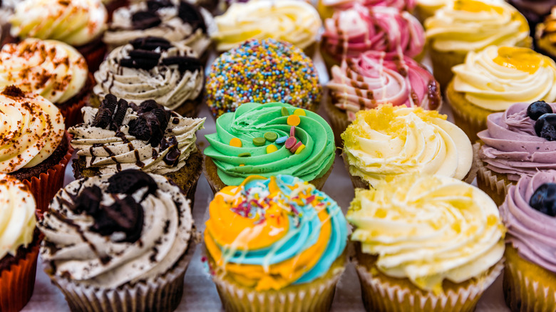 Decorated cupcakes in neat rows