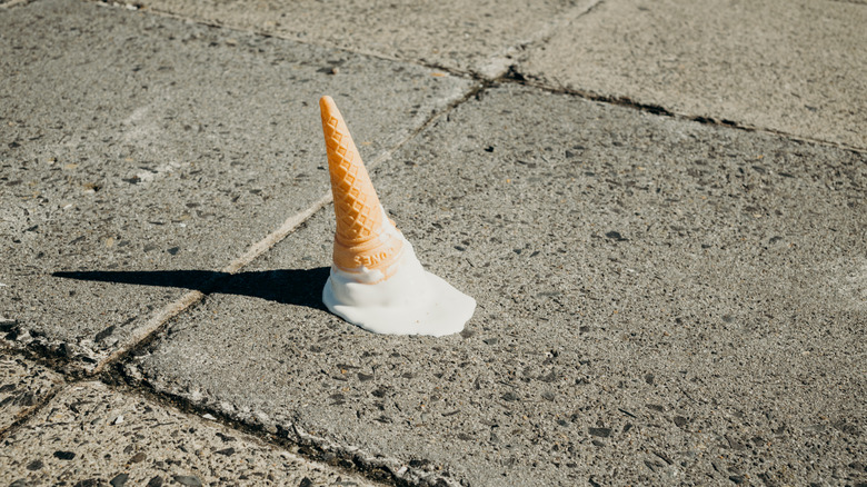 Ice cream cone upside down melting on the sidewalk