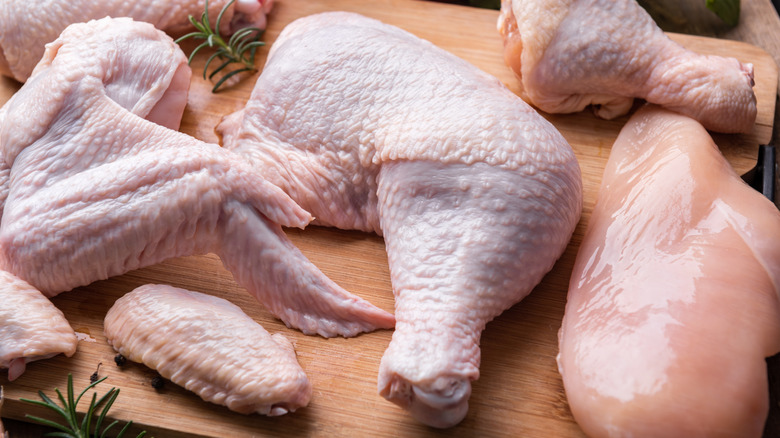 Raw chicken parts on a cutting board