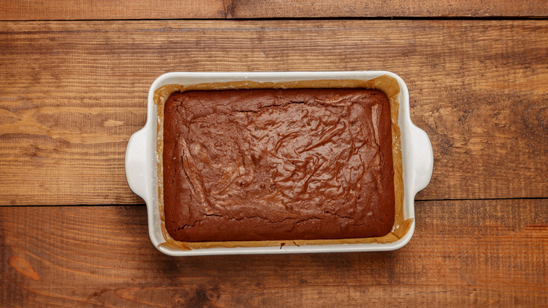 Chocolate cake in a white ceramic baking pan