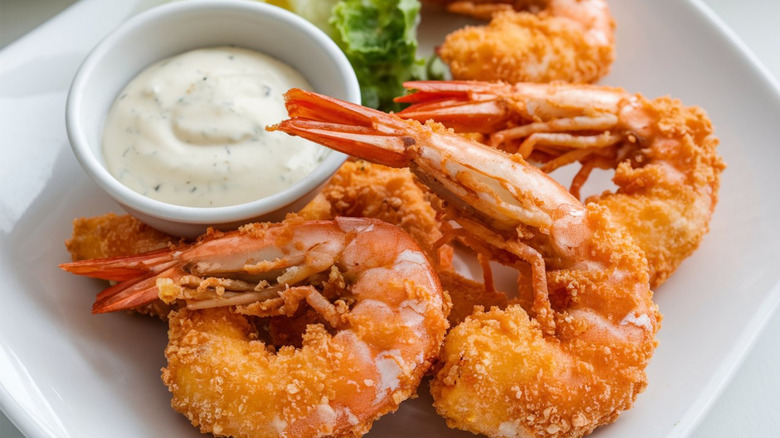 Fried shrimp with dish of white sauce