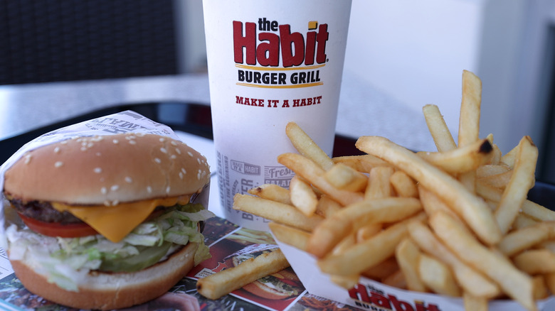 A burger, fries, and a drink from The Habit Burger and Grill on a tray