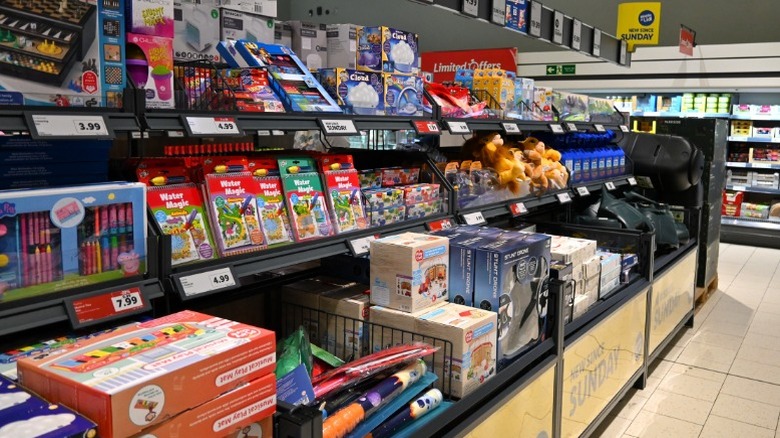 An Aldi Finds aisle full of children's coloring books, toys, and games.