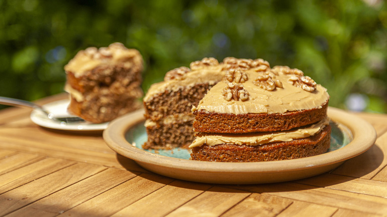 A coffee and walnut cake sitting on a table.