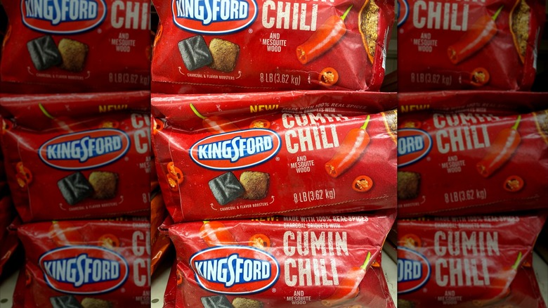 Bags of Kingsford cumin and chili-flavored charcoal on display at a store