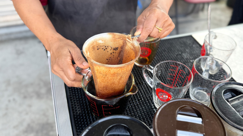 Person using cloth coffee filter