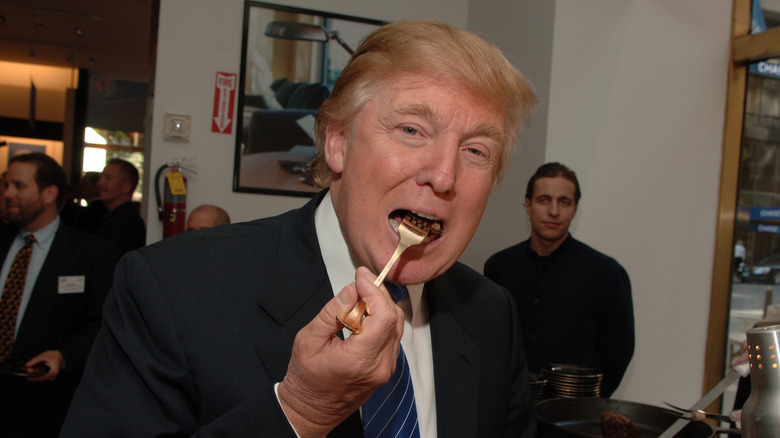Donald Trump eating with gold fork