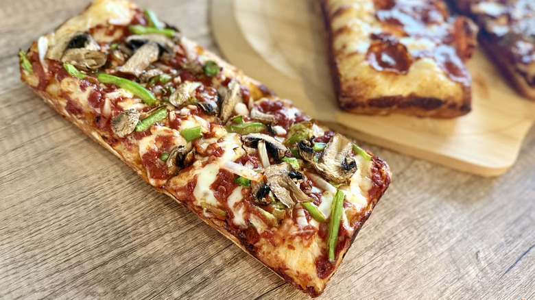 Veggie Domino pizza with others in the background