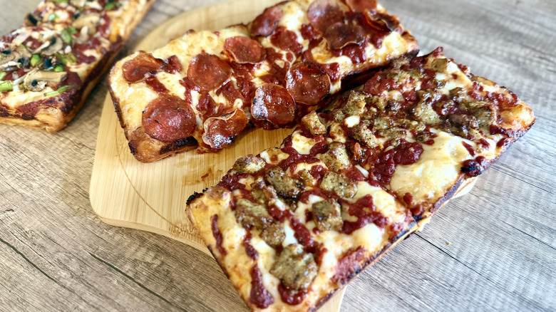 Domino's Detroit style pizzas with sausage and pepperoni toppings